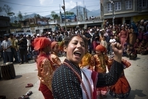 UPBEAT: Performers dance at a Maoist rally in Chobhar on Friday morning.