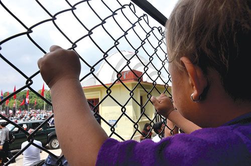WHAT'S HAPPENING? A child looks on as the RPP-N holds a mass meeting at Khula Manch, Kathmandu, on Friday.
