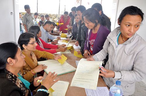 EYO EYO: Applicants for the Test of Proficiency in Korean (TOPIK), a mandatory test for employment permit in South Korea at the ANFA stadium, Balkumari, Kathmandu, on Monday. More than 60,000 aspiring workers applied for the test.