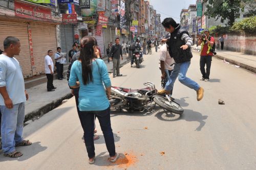 IS THIS A SOLUTION? : Protestor attacks a vehical of a civilian at bagbazar infront of Padmakanya Campus during bandh on Friday.