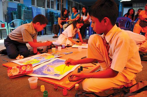 COLOURFUL MEMORIES: Students at the Amar Art Competition organised at the Dallu Residential School on Tuesday, in memory of artist Amar Chitrakar. A hundred and forty-seven students participated in the event.
