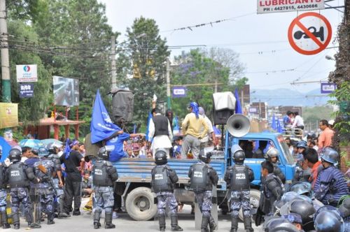 NO NOISE PLEASE: The Nepal Police borders the restricted area in Baneswor, ahead of the CA building, as the Chettri Samaj parks a pick-up truck with protesters.