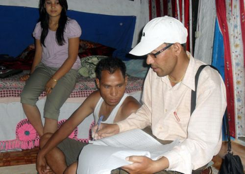 KEEPING THE COUNT: An enumerator lists a family's basic information at a house in Narayan municipality, Dailekh on Monday. Enumerators have been deployed to visit every house in the country ahead of the nationwide survey for the population census, to be conducted from 17 to 27 June 2011.
