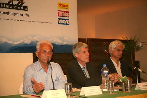 FRIENDLY GESTURE: Maoist leader, CP Gajurel, speaking at a panel on Tuesday to discuss foreign aid and development. The other speaker was Markus Heiniger from the Swiss Foreign Ministry (middle). The session was moderated by Kunda Dixit, editor of the Nep