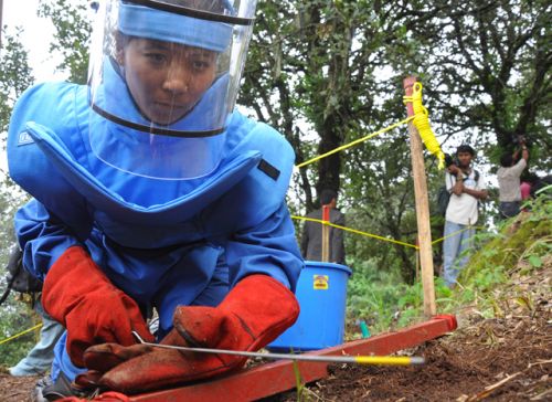 LAST STROKE: A Nepal Army personnel clears the land minefield located at Phulchowki, Lalitpur, on Tuesday. This marks the conclusion of NA's demining works.