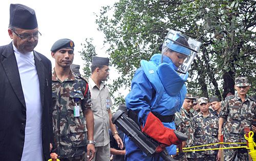 NO UXO: PM Jhala Nath Khanal looks on as Captain Dikshya Rajbhandari of Nepal Army conducts the demining exercise at the landmine field in Phulchoki on Tuesday, marking the conclusion of the NA's demining initiative.