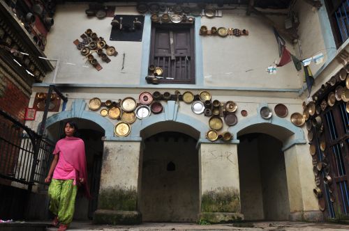 POTS AND PANS: The Adhinath Lokeshwore temple at Chobhar, Monday. The temple dates back to the 15th century and is noted for its walls adorned with metal utensils. Newly weds hang utensils in the temple praying for a happy married life.
