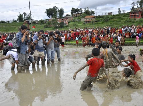 SAY SPLASH! Photojournalists take snaps of children celebrating 15 Asar at Bageshwori‚ Bhaktapur on Wednesday. The day traditionally marks the beginging of paddy plantation.