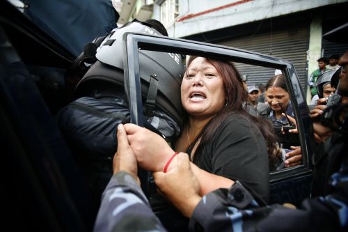 BANNED: Police arrest a Tibetan exile on her way to Dalai Lama's birthday celebration at Swayambhu, Wednesday. Authorities have enforced a ban on the celebration of the Tibetan spiritual leader fearing they would turn into anti-Chinese protests.
