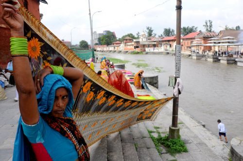 HOLY WASH: Devotees from Mureni, a village in Madya Pradesh, India, on the banks of Bagmati River at Pashupati Nath Temple on Monday.