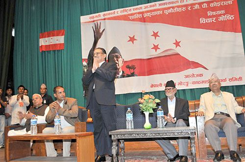 OVER SHADOWED: Maoist Chairman Pushpa Kamal Dahal, UML President Sushil Koirala and UML leader Madhav Kumar Nepal at an interaction program on challenges of the peace process in Kathmandu on Wednesday.