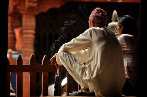 NO SMOKING!! : A man smoking cigarette at Basantapur Durbar Square on Sunday. From this Sunday Nepalese government implements the Act, signed by President Dr Ram Baran Yadav, forbid smoking in community places Government even prohibited sales of tobacco products to pregnant women and people below the age of 18.