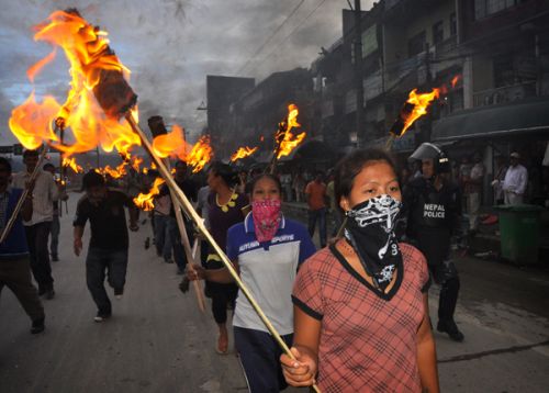 WE DIDN'T START THE FIRE: Disqualified PLA combatants in a torch rally on Sunday, demanding relief packages promised by the Maoists and government. Over 4,000 combatants were disqualified by the UNMIN during the verification process.