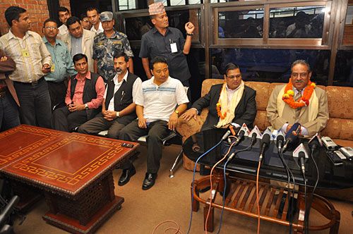 BACK HOME: Maoist Chairman Pushpa Kamal Dahal meets the press at Kathmandu airport Wednesday, on return from Malaysia. With him on the flight were board members of the Asia Pacific Exchange and Cooperation Foundation (APECF) who want to develop Lumbini.