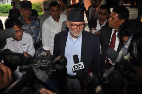Chairman of Nepali Congress Sushil Koirala interact with journalist after their meeting with China's Politburo Standing Committee Member Zhou Yongkang in Kathmandu on Tuesday.