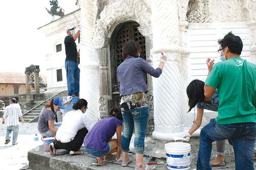 FACE LIFT: The Kalmochan Temple in Thapathali gets a new coat of paint on Saturday by Facebook activists.