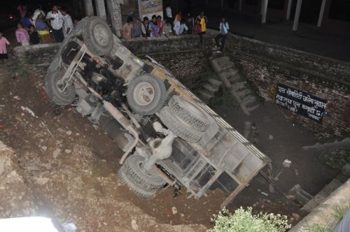 FATAL SLIP: A truck tumbled over at Shovahiti, Lalitpur on Saturday. The pot-holed roads become worse during monsoon, increases incidents of accidents.