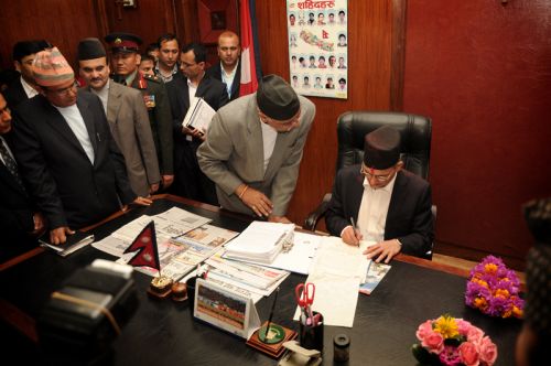 NEW SEAT: PM Baburam Bhattarai takes his seat at the prime minister's office at Singa Darbar on Monday.