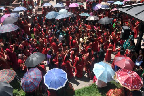 BEAUTIFUL RED: Women line up at Pashupati Temple on the occasion of Teej festival on Wednesday.