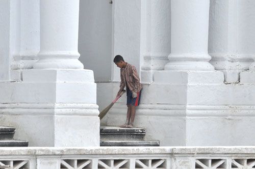 FACE-LIFT: A boy cleans up as the Gaddi Baithak, Basantapur Darbar Square, gets a fresh coat of paint on Tuesday, ahead of Indra Jatra on Sunday .