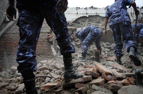 QUAKE EFFECT: Security personnel clear a rubble in Bhaktapur after the earthquake on Sunday.