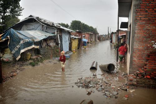 FLOOD: After two days of incessent rain, the Bagmati River overflows into the slum settlements on its banks at Thapathali on Monday.