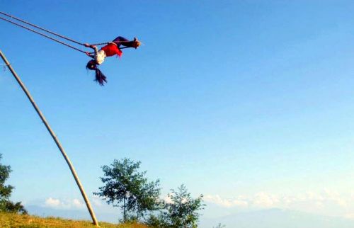 ON THE FOURTH DAY OF DASAIN: A young girl soars on a traditional Dasain swing in Lalitpur on Sunday, under a deep blue Himalayan autumn sky.