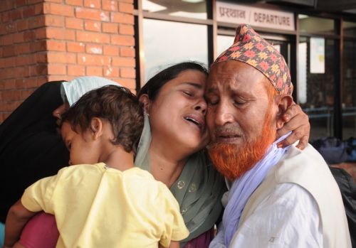 PILGRIM'S PROGRESS: A Nepali Muslim woman bids farwell to her relatives at Tribhuwan International Airport before heading towards Saudi Aribia for the annual Hajj pilgrimage. The Central Hajj Committee has said 866 Muslim pilgrims will go to Mecca from Nepal this year.