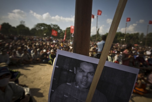 A Maoist martyr's portrait is hung on a pole during a Maoist celebratory rally of the nation turning republic at Khula Manch Friday afternoon.