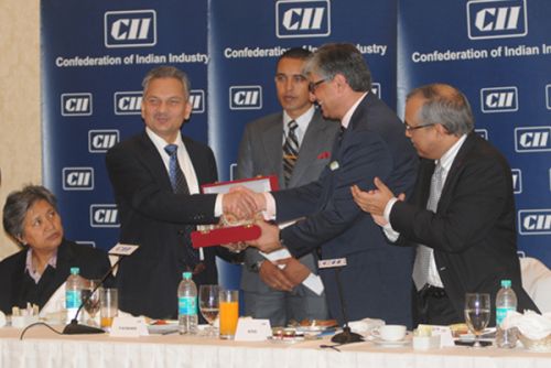 ECONOMIC MATTERS: PM Baburam Bhattarai at a tea party organised by Confederation of Indian Industry in New Delhi on Saturday.