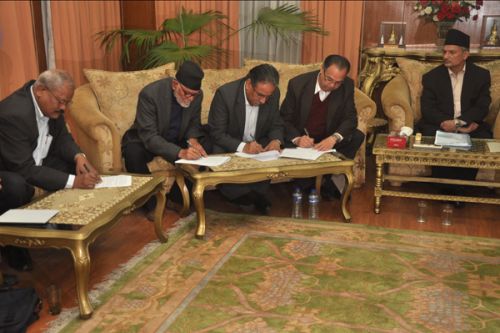 INKED: PM Baburam Bhattarai looks on as UML Chairman Jhalnath Khanal, Maoist Chairman Pushpa Kamal Dahal, NC President Shushil Koirala and Madhesi Alliance leader Bijay Kumar Gachchhedar sign a 7-point deal on contentious issues of peace and constitution writing process, at the PM's residence, Baluwatar, late Tuesday evening.
