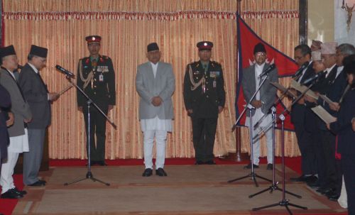 NEW MINISTERS: PM Baburam Bhattarai administering the oath of office to new ministers at the Presidential residence at Shital Niwas, Tuesday. With the fifth expansion, the number of ministers in the cabinet has reached 37.