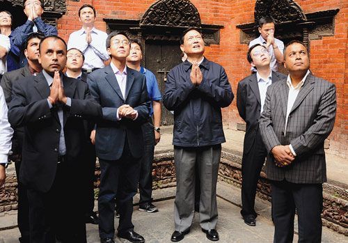 DIVINE GLIMPSE: Chinese delegation under the leadership of Liu Qi, Politburo Member of the Communist Party of China (centre) and the Chinese ambassador to Nepal Yang Houlan (left) greet Goddess Kumari at the Kumari House in Basantapur, Kathmandu, on Sunday.