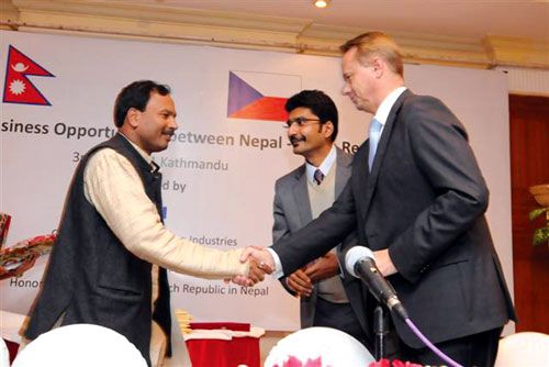 CZECH THIS OUT: Industry Minister Anil Jha shakes hands with the Deputy Environment Minister of Czech Republic Tomas Tesaf during a business and trade seminar on 3 November organized by the Confederation of Nepalese Industries. Also in the picture is the Honorary Consul General of the Czech Republic to Nepal, Vishnu Agrawal.