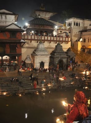 In MEMORY: A devotee lights an oil lamp in memory of a departed family member on the banks of Bagmati, Pashupatinath Temple, during Bala Chaturdashi festival in Kathmandu on Wednesday.