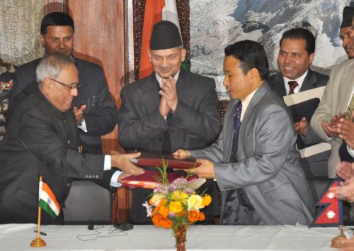 DOUBLE CLAP: Indian Finance Minister Pranab Mukharjee and Finance Minister Barsa Man Pun exchange agreements, signifying the signing of the Double Taxation Avoidance Agreement (DTAA) with India at Prime Minister's office, Singha Durbar on Sunday. The agreement was decided upon during PM Baburam Bhattarai's visit to India in October.