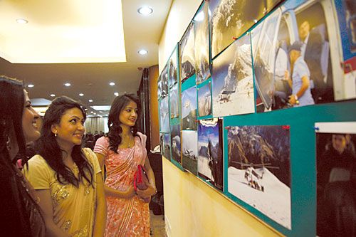 UP IN THE AIR: Air hostesses observe the winning photographs of an aviation photography competition at the Airport Hotel, Gaushala, Kathmandu, on Wednesday. The exhibition was organised to mark the International Civil Aviation Day
