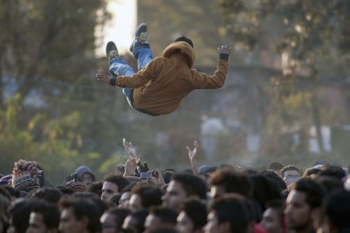 UP IN THE AIR: A fan is thrown up in the air by his friends at the Rock Aawaaz concert, at Bhrikuti Mandap Funpark, Kathmandu, on Saturday.