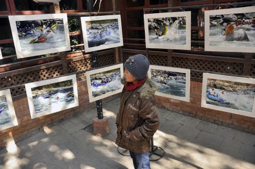 WILD WATERS: A visitor at a photo exhibition of rafting at Bhotekosi River, Sindhupalchok, held at Nepal Tourism Board, Kathmandu on Wednesday. The exhibition was organised to mark the 22nd aniversary of Nepal Association of Rafting Agents.