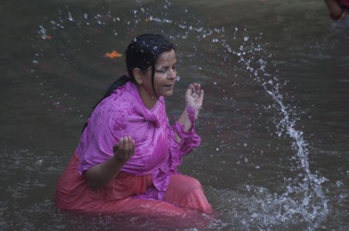 HOLY DIP: A woman taking holy bath on the first day of Swoshtani at Salinadi on Monday morning, which will continue for a month.