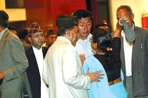 RAGE: At the CA's first session on 28 May, UML MP Kamala Sharma takes off her shoe to beat NC leader Purna Bahadur Khadka, who she holds responsible for the death of her husband Rishi Prasad Sharma during the election campaign. Khadka's bodyguards shot him.