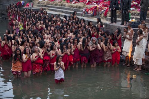 HOLY DIP: Devotees take a dip in the Bagmati River at Pashupatinath Temple as part of the month-long Swasthani fast on Monday morning.