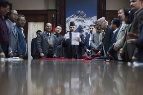 DIVIDING UP: PM Baburam Bhattarai holds a report submitted by the State Restructuring Commission (SRC) submitted on Tuesday. SRC has proposed an 11-state federal model based on ethnicity and language.