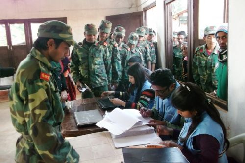 GOING HOME: Maoist combatants who have opted for oluntary retirement schem collect the first installment of their financial package at the Fourth division camp in Jhyaltung, Nawalparasi on Friday.