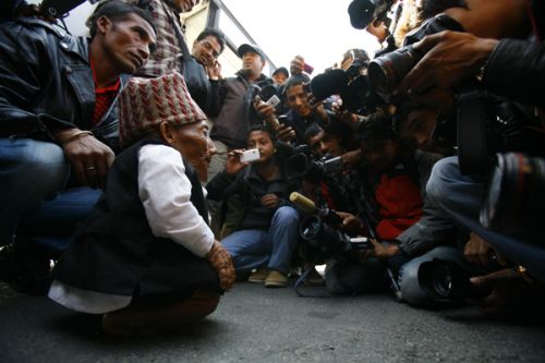 SHORT RECORD: Chandra Bahadur Dangi, 72, who claims to be the world's shortest man standing at a height of 22 inches, talks to journalists at the domenstic airport upon his arrival to Kathmandu from Nepalgunj on Wednesday.