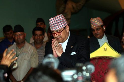 GREETINGS: Gyanendra arrives at his press conference.