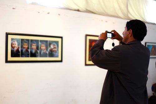 FRAME BY FRAME: A visitor at an exhibition of potraits, 'A Candid Portrait', by photojournalist Laxmi Prasad Ngakhusi, at Nepal Art Council, Babarmahal, on Friday.