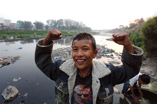 SURVIVOR: A child from the slum in Thapathali after a dip in the Bagmati River on Wednesday evening.