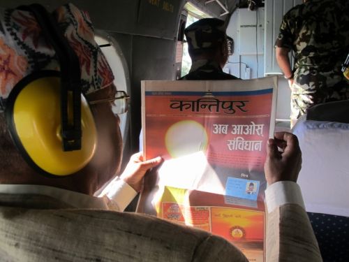 CATCHING UP: President Ram Baran Yadav with the Friday papers before flying off on a five-stop tour through central Nepal on Nepali New Year's Day during which he said he would not approve a new constitution that would lead to the country's dismemberment.