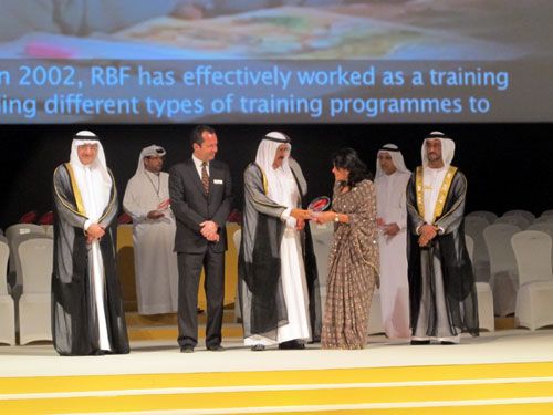 WELL DONE: Sheikh Hamdan Bin Rashid Al-Maktoum, Deputy Ruler of Dubai and Minister of Finance, hands over the 2012 UNESCO Prize for Outstanding Practice and Performance in Enhancing the Effectiveness of Teachers to Shanta Dixit, president of the Rato Bangala Foundation. The event was held in UAE on Tuesday.